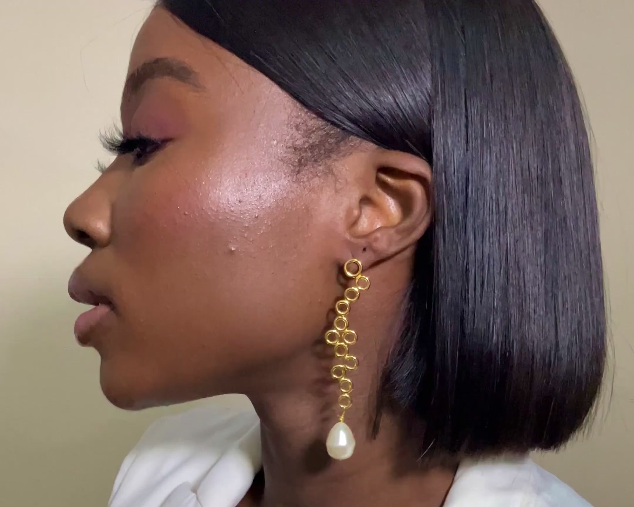 video preview of the di kan drop earrings